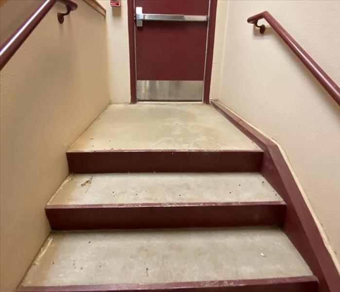 Cement Stairwell with Red Door 