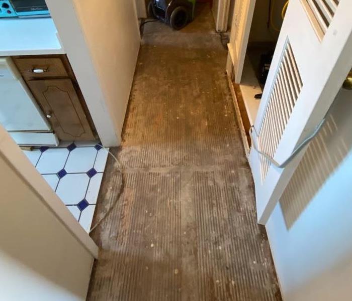 Hallway after mitigation with floors ripped up