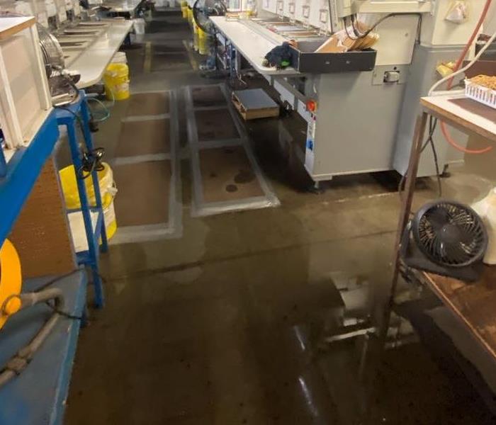 commercial warehouse with standing water on the floor
