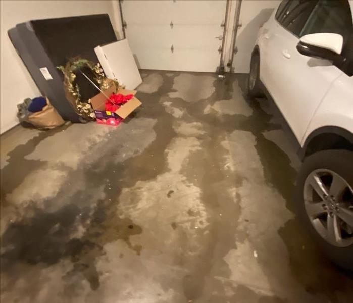 Garage Water Damage in West El Paso with Standing Water